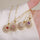 The Grounded Collection - Spinning Necklace Gold Plated with RED Gems